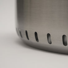 Load image into Gallery viewer, Close up of the Ecoflame smokeless fire pit air vents at the bottom of the fire pit