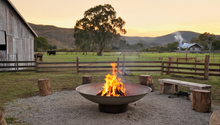 Load image into Gallery viewer, 1200mm cast iron fire pit in a farm