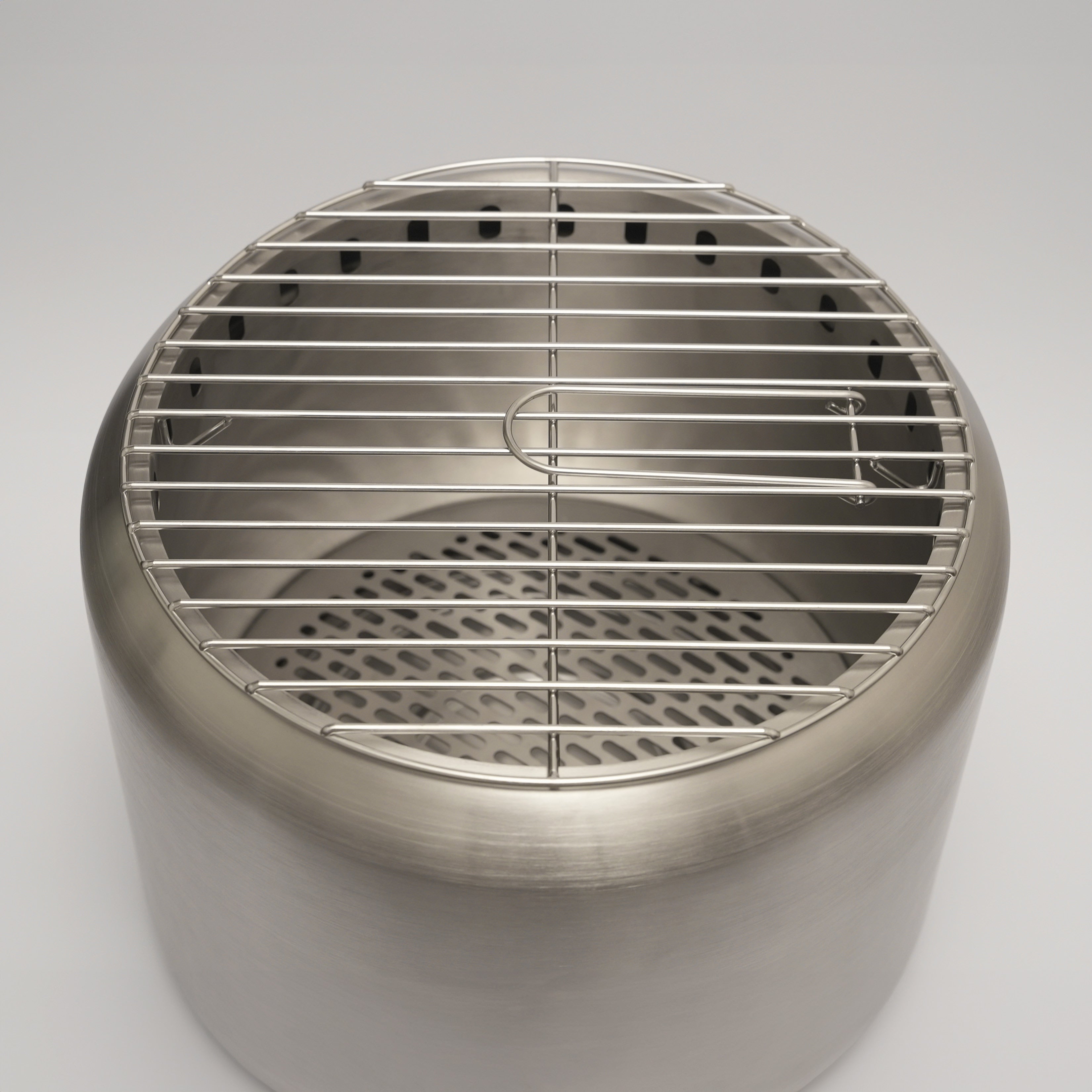 Close up of the Ecoflame smokeless fire pit and cooking grill