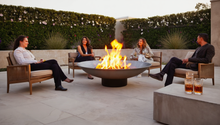 Load image into Gallery viewer, 1200mm cast iron fire pit with people sitting around lit firepit
