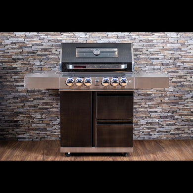 Stainless steel barbecue grill with a stone wall background