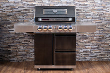 Load image into Gallery viewer, Stainless steel grill with black accents against a stone wall background
