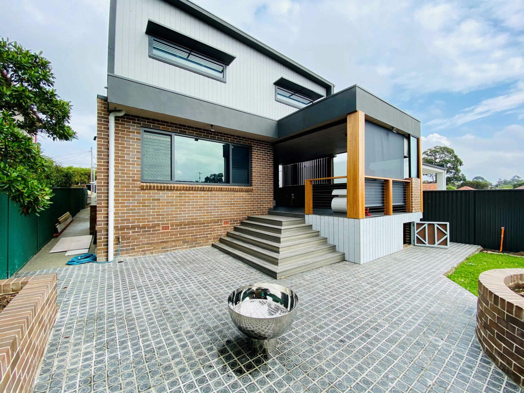 The Goblet Fire Pit – Stainless Steel in yard