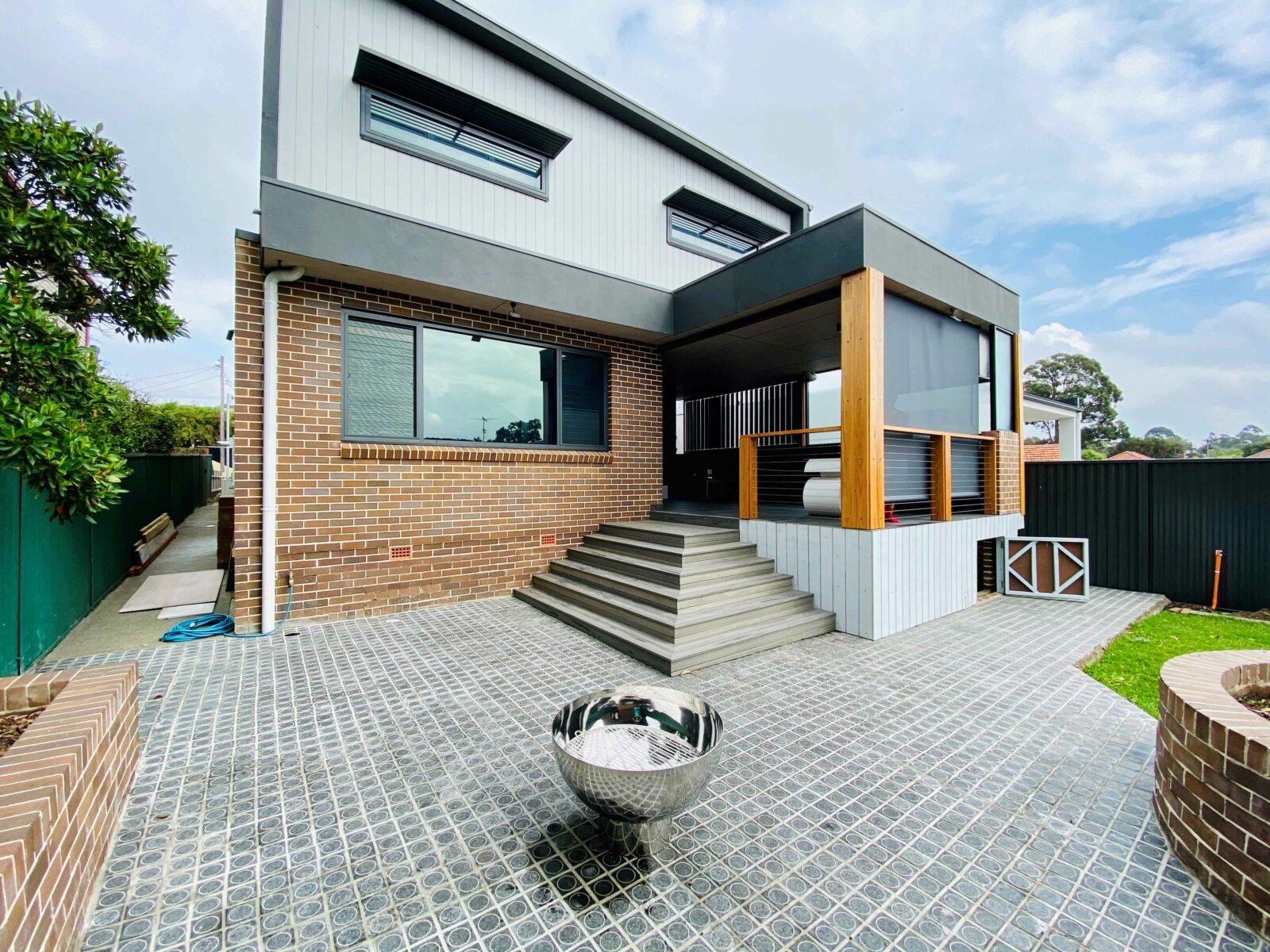 The Goblet Fire Pit – Stainless Steel in yard