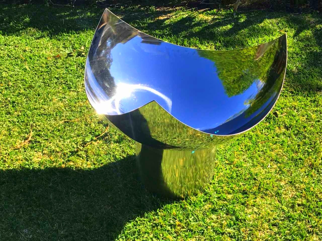 The Chalice Fire Pit - Stainless Steel on grass