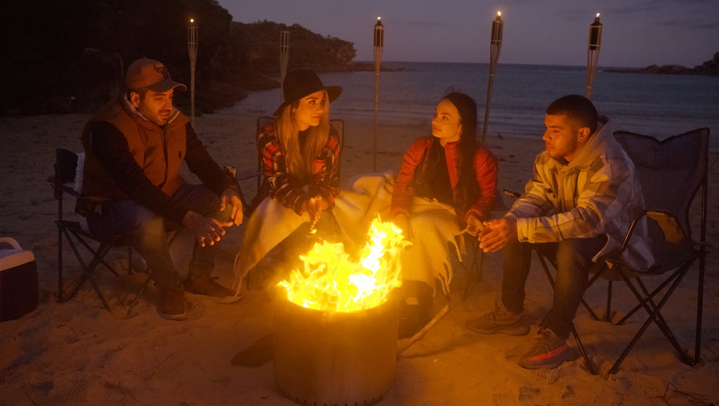 People gathering around the Ecoflame Smokeless fire pit