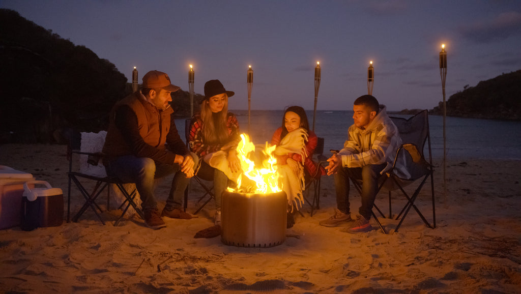 People gathering around the Ecoflame Smokeless fire pit
