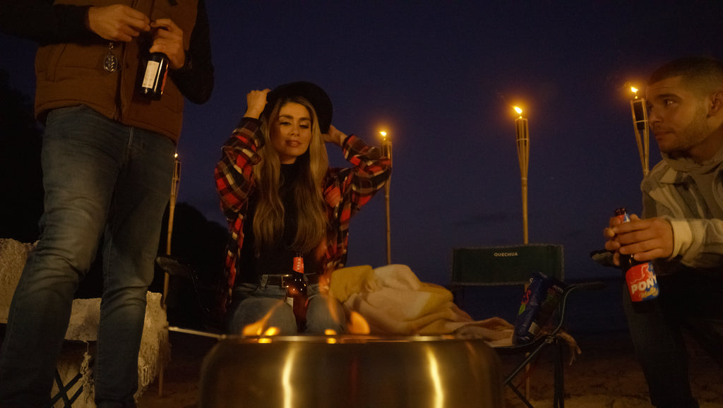 People gathering around the Ecoflame Smokeless fire pit