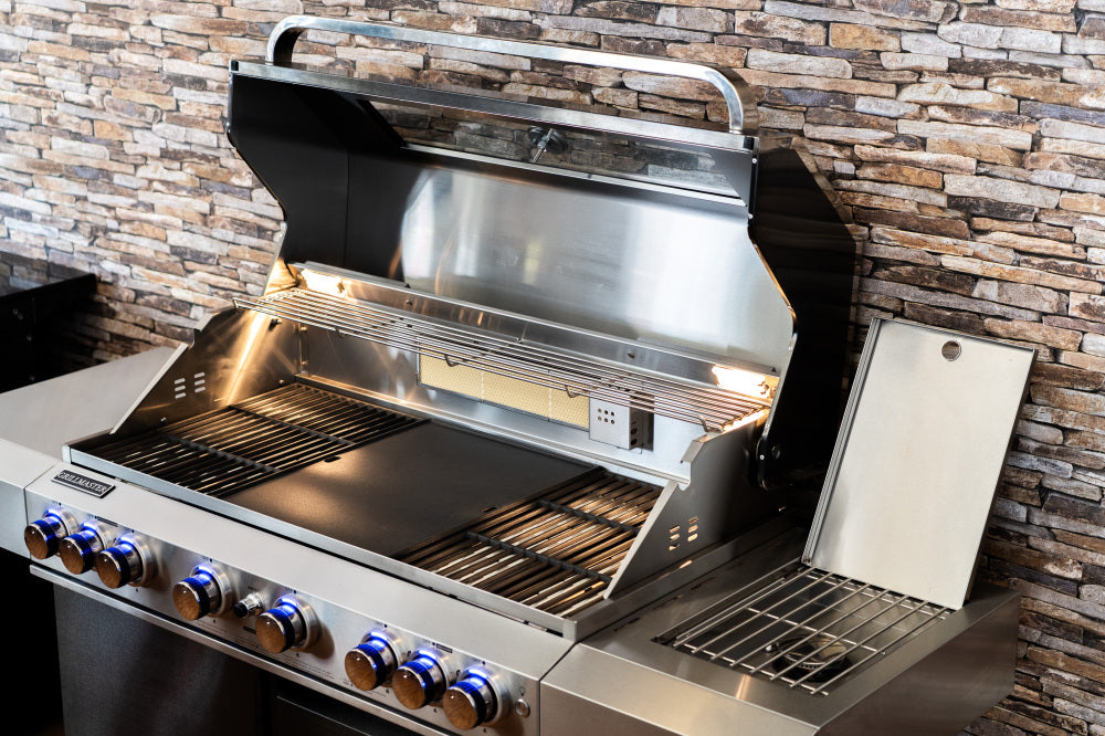 Stainless steel outdoor grill with stone wall background