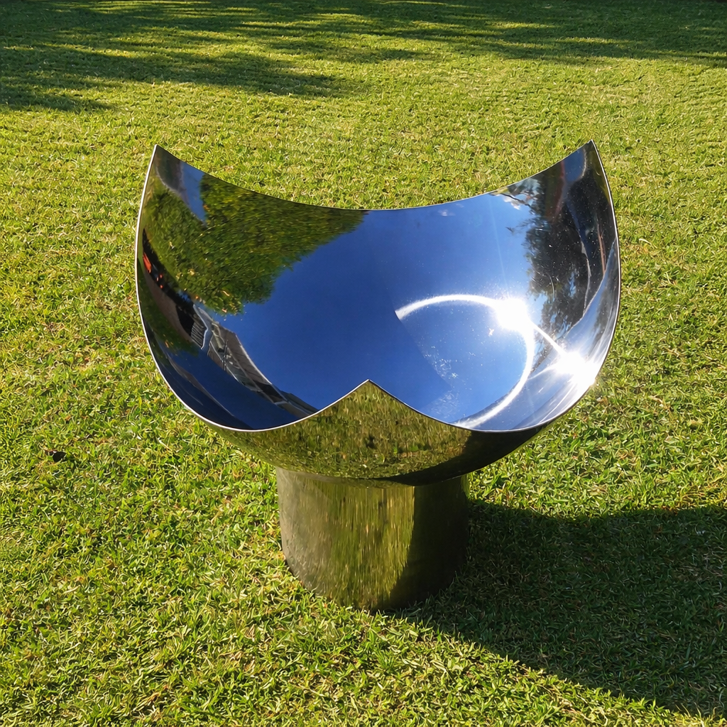 The Chalice Fire Pit - Stainless Steel on lawn