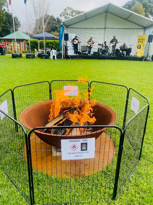 The Basin Cast Iron Fire Pit - 1200mm at an outdoor concert