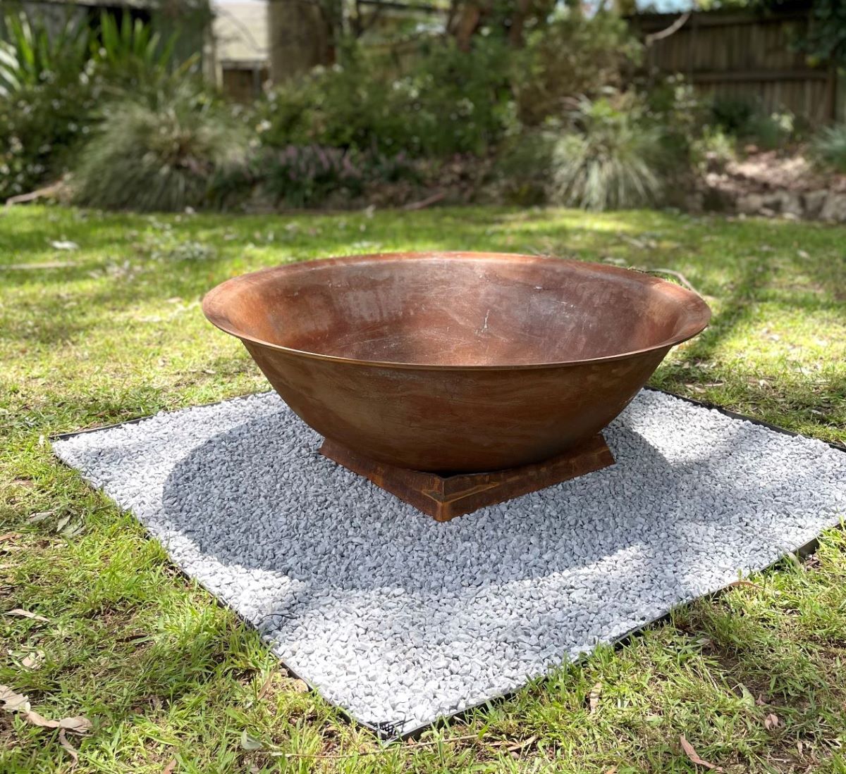 The Basin Cast Iron Fire Pit - 1200mm in the yard
