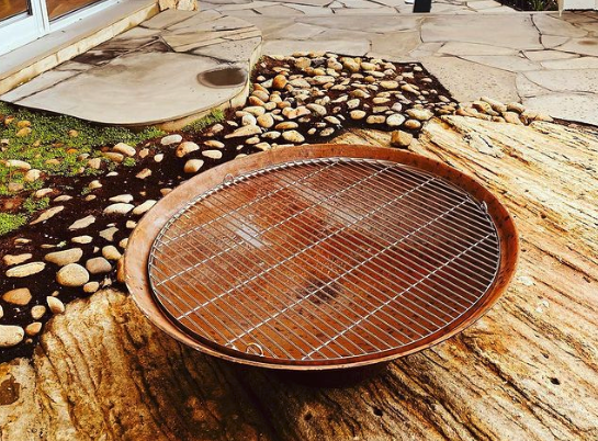 Round fire pit with stainless steel cooking grill